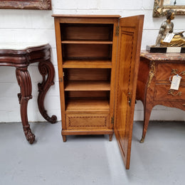 French Art Deco inlaid Oak curio/side cabinet with a lift up top and glass underneath. There are two fixed shelves, two adjustable shelves and one hidden drawer. Sourced from France and in good original condition.
