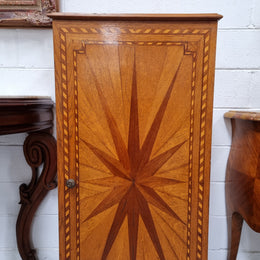 French Art Deco inlaid Oak curio/side cabinet with a lift up top and glass underneath. There are two fixed shelves, two adjustable shelves and one hidden drawer. Sourced from France and in good original condition.