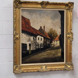 Dutch signed oil on canvas depicting village street in a beautiful gilt frame. It is in good original detailed condition and has been sourced from France.