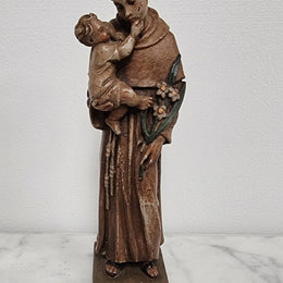 Vintage wood carved St. Anthony and baby Jesus statuette. Hand painted and is in good detailed condition.