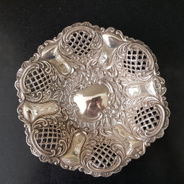 A Sheffield sterling silver bowl with repousse pattern, hallmarked WALKER & HALL and in good original condition.