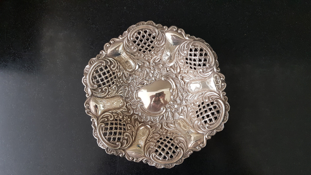 A Sheffield sterling silver bowl with repousse pattern, hallmarked WALKER & HALL and in good original condition.