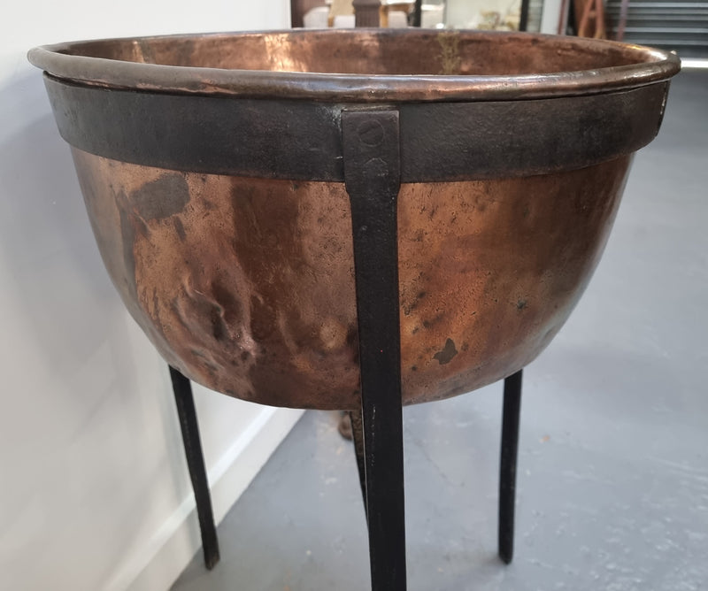 Fabulous Antique French copper pot on a solid iron stand in good original detailed condition. see photo for full description of condition.