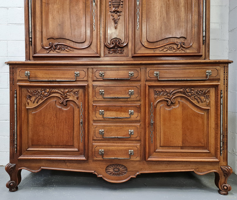 Beautiful 19th century Walnut Louis XV style sideboard with plenty of storage space. The top has two doors that open up to three adjustable shelves. It is in good original detailed condition.