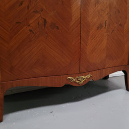 French Louis 15th style Kingwood marquetry inlaid two door cupboard with a beautiful marble top. It has three adjustable shelves and decorative ormolu trim. It has been sourced from France and is in good original detailed condition.