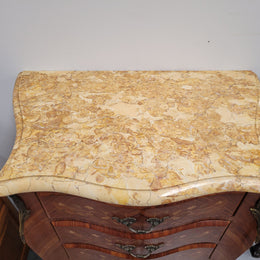 Stunning French seven drawer Kingwood and marquetry inlaid semainier with a beautiful marble top. In good original detailed condition.