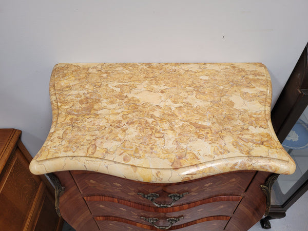 Stunning French seven drawer Kingwood and marquetry inlaid semainier with a beautiful marble top. In good original detailed condition.