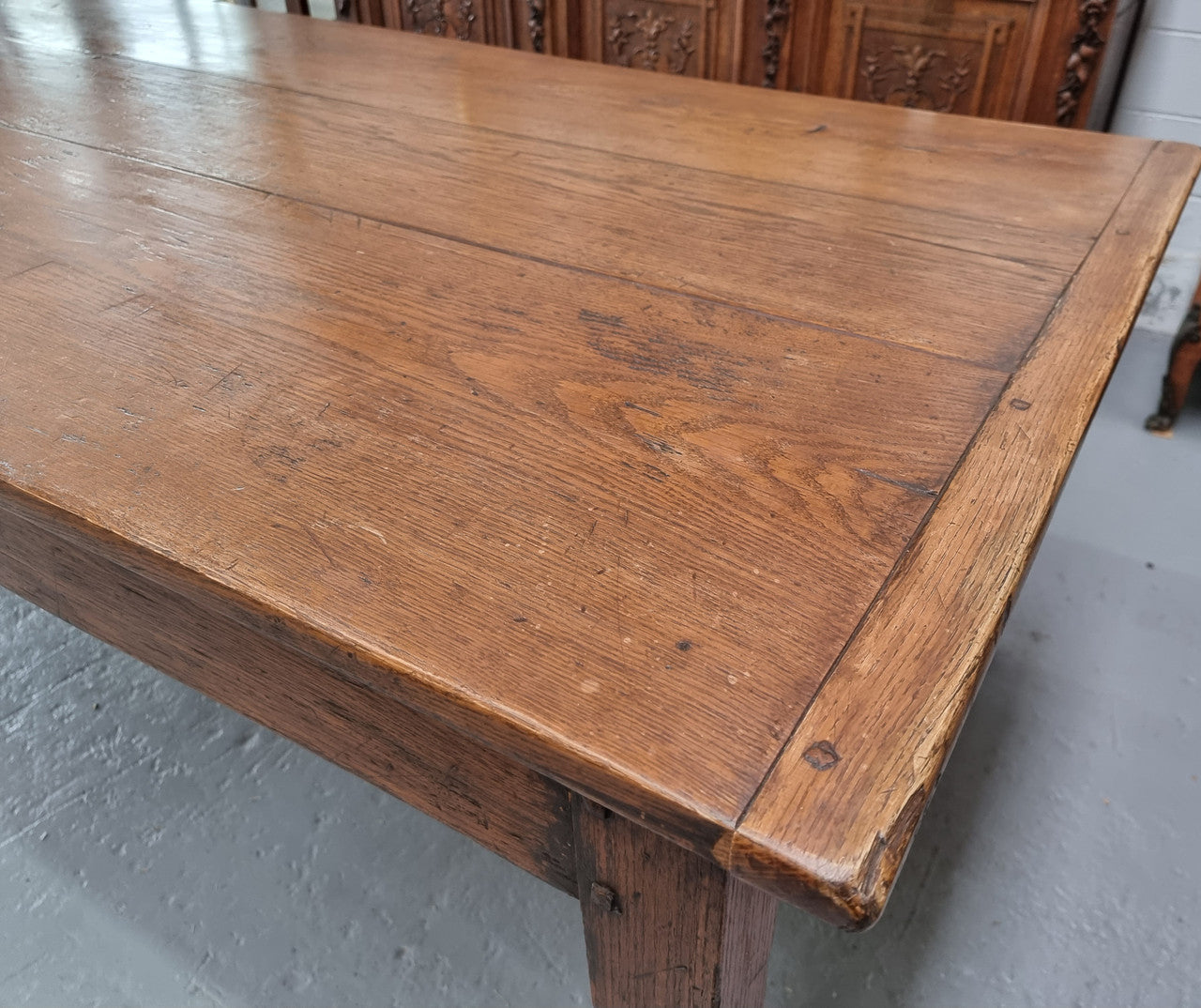 Amazing 19th Century French Oak Farmhouse Style Dining Table with three drawers. It is made from 3 large planks of wood which is very hard to find. 105.5 cm wide.