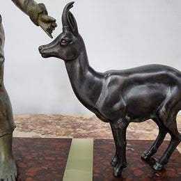 French Art Deco spelter and marble statue of a boy and two deers in good original condition.