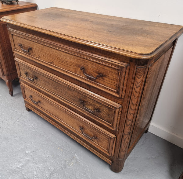 French solid Oak Louis 14th style chest of three drawers. It has three large spacious drawers and it has been sourced from France. It is in good original detailed condition.