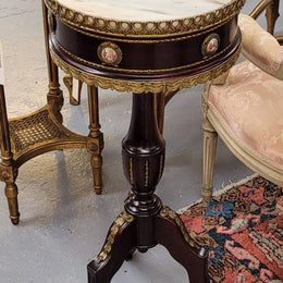 Elegant French louis XVI revival style round marble top side table with ceramic features and ormolu decoration. It is in good original detailed condition and has been sourced from France.