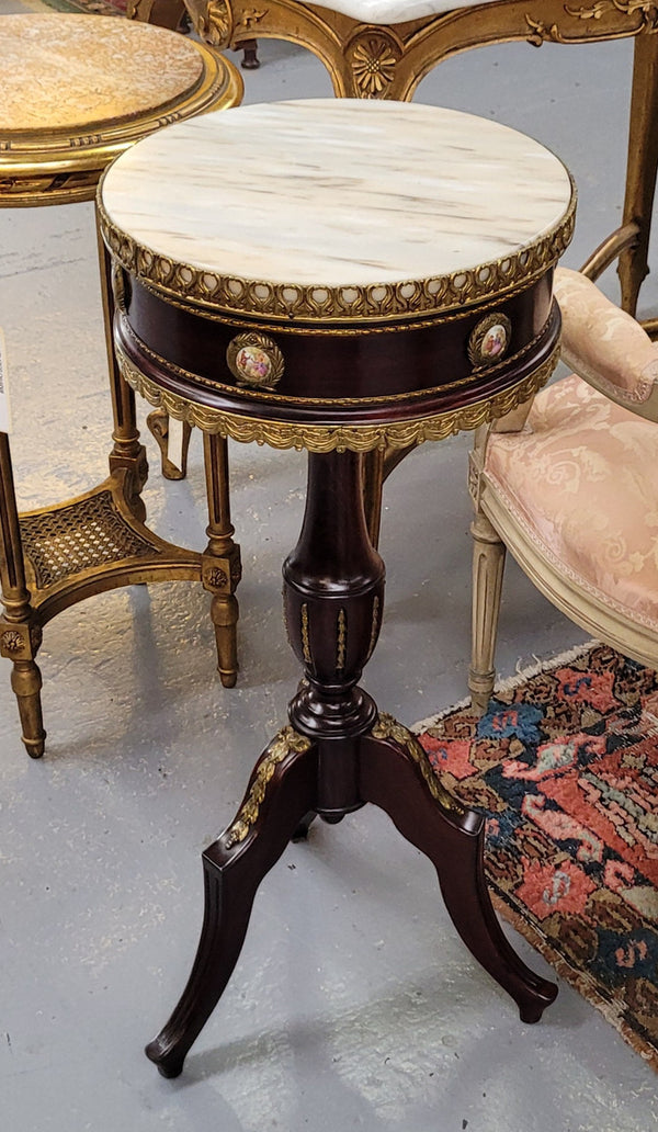 Elegant French louis XVI revival style round marble top side table with ceramic features and ormolu decoration. It is in good original detailed condition and has been sourced from France.