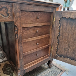 Fabulous Louis XV style French Oak beautifully carved full partners desk. Both sides have a functioning drawer in the middle and two cupboards either side. On both sides one cupboard door opens up to four smaller internal drawers. Plenty of storage space and a large top surface to work on. It is in good original detailed condition.