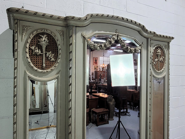 Stunning and desirable Antique French three full length mirror doors, Louis Xl style armoire with original chalk paint finish. With superb carving and decoration. Plenty of storage space with hanging space and shelves.