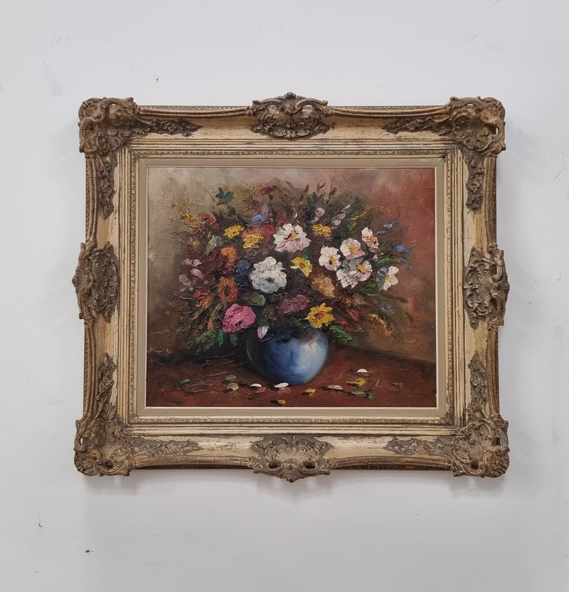 A beautiful sourced in France Floral oil on canvas in an ornate decorative frame. In good original detailed condition.