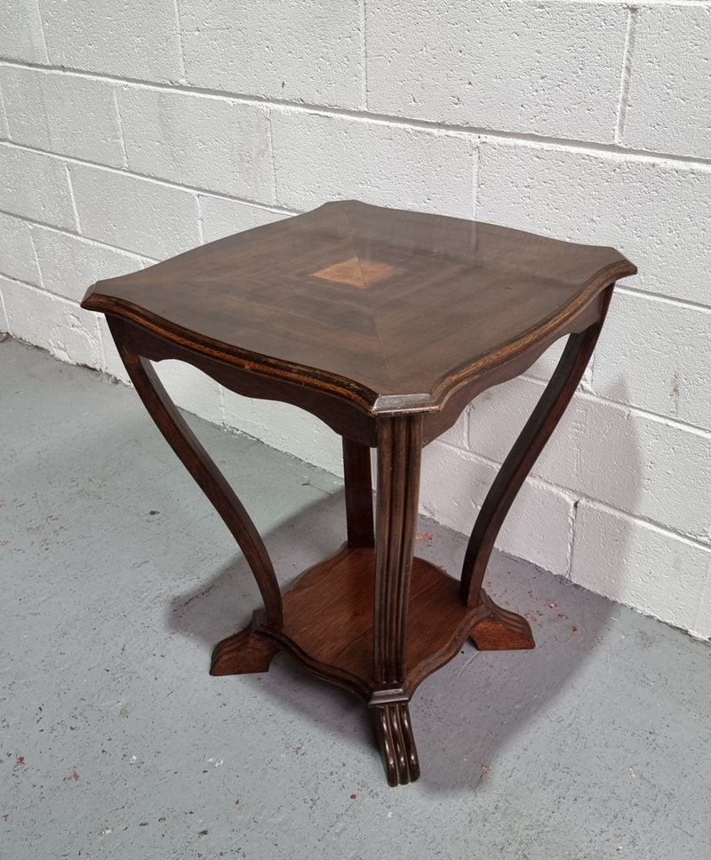 Charming Art Deco Square coffee table.  Patterned veneer Top with legs shaping into a lower shelf. In good detailed condition.
