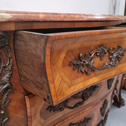Sensational Grand French Walnut Bombe Commode with beautiful marquetry inlay. It has lovely decorative hardware and an amazing marble top in good original detailed condition.
