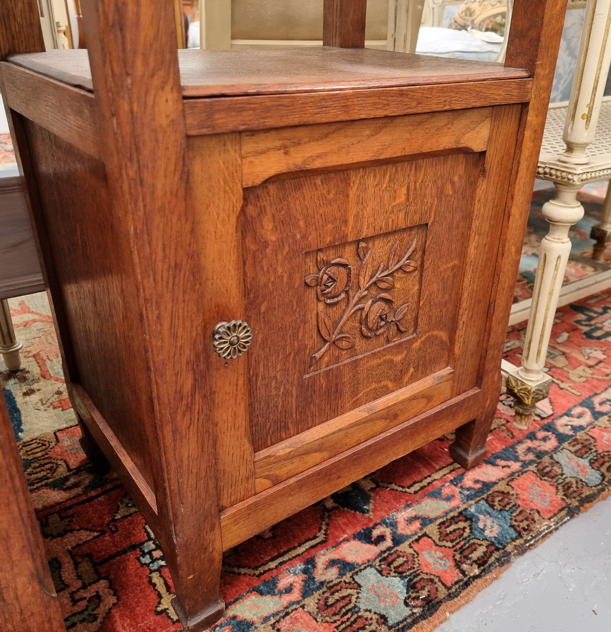 Charming pair of French Oak Arts and Crafts bedsides with shelf, cupboard with carving and marble top.  They have been sourced from France and are in good original detailed condition.