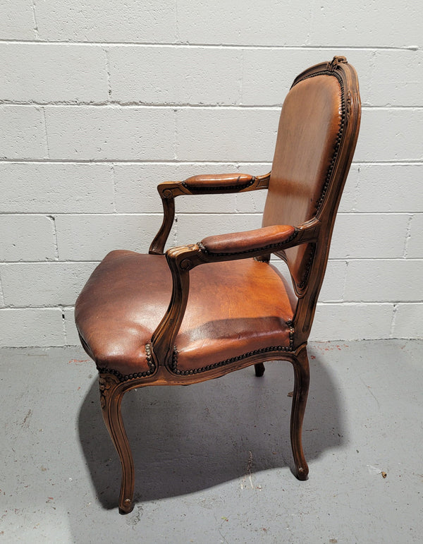 French Walnut Louis XV style desk chair with faux leather upholstery. The upholstery is in good original condition and very comfortable to sit in.