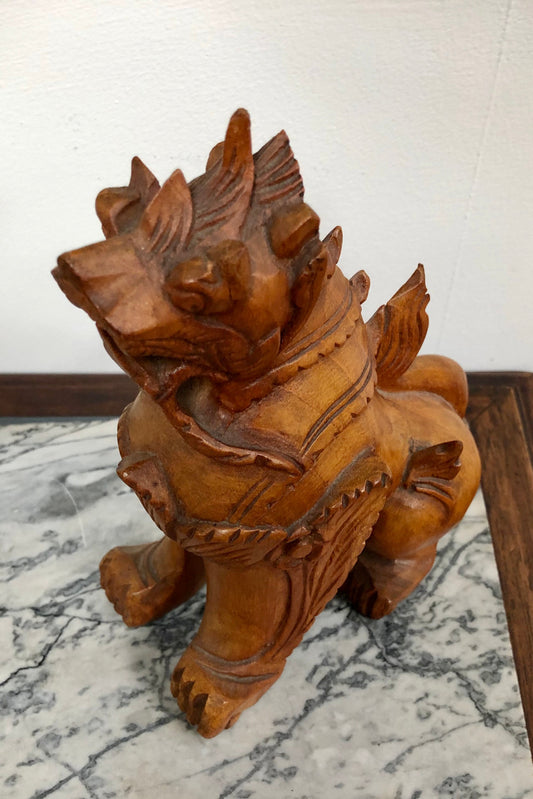 Chinese carved Teak Foo dog with very good detail. In good original condition.