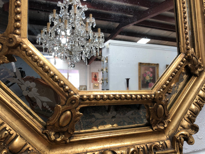 Early 19th Century gilt cushion mirror with acid etched floral pattern. In good condition. Please note original mirror does show some spotting commensurate with its age. Circa