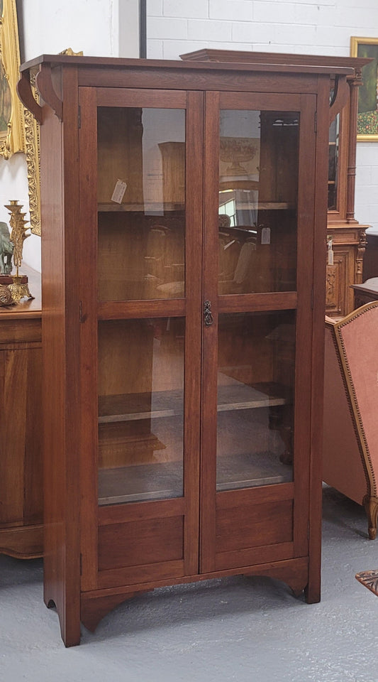 Beautiful two door Blackwood bookcase with glass doors and with four fully adjustable shelves. It is in good original detailed condition.
