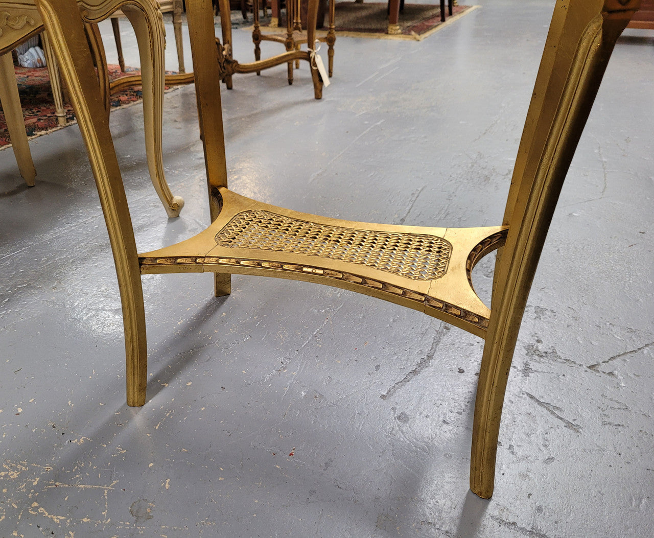 Impressive French oval Louis XVI style gilt and white marble topped two tier lamp/side table. It has been sourced from France and is in good original detailed condition.