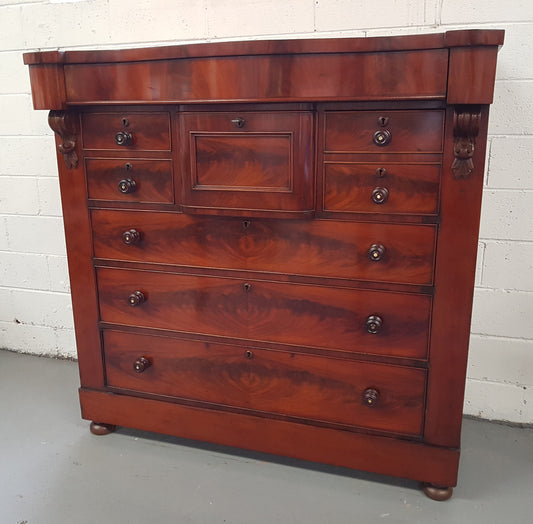 Victorian Flame Mahogany chest of eight drawers. Wooden handles with inlaid mother of pearl, hat drawer has key and lock that works. In good original condition, all drawers run smoothly.