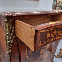 Stunning French Transitional style Mahogany marquetry inlay salon cabinet in the bombe shape. It has one draw, one shelf, marble top & ormolu decoration. Sourced from France and in good original detailed condition.