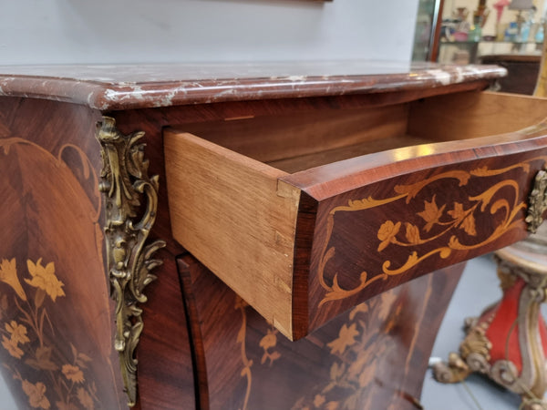 Stunning French Transitional style Mahogany marquetry inlay salon cabinet in the bombe shape. It has one draw, one shelf, marble top & ormolu decoration. Sourced from France and in good original detailed condition.