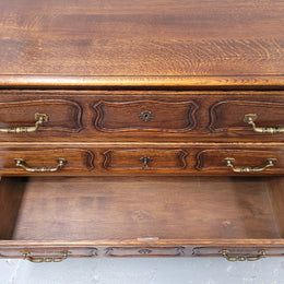 French Provincial Oak three drawer wooden top commode. It has elegant carvings and handles. It has been sourced from France and is in good original detailed condition.