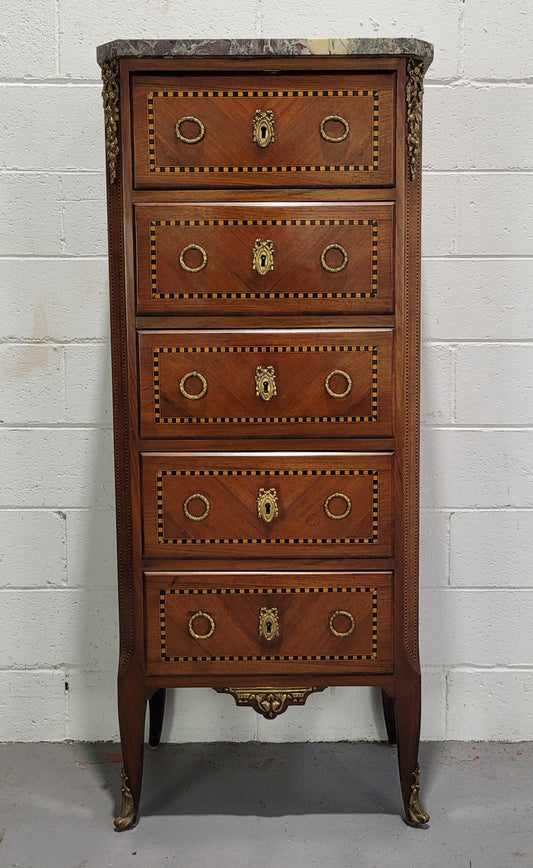 Louis XIV style tall chest of five drawers with stunning marble top. It is of small proportions and has very nice mounts and handles. In good original detailed condition.