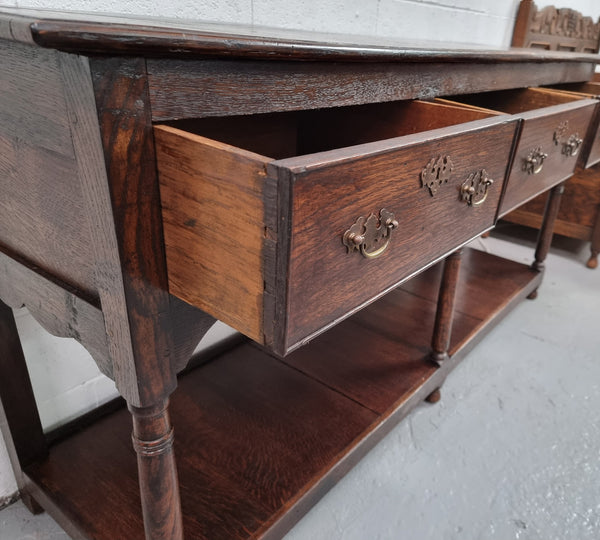 Antique 19th Century English dark Oak three drawer Dresser with brass handles and in good original condition.