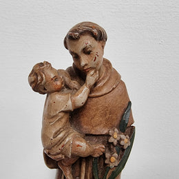 Vintage wood carved St. Anthony and baby Jesus statuette. Hand painted and is in good detailed condition.