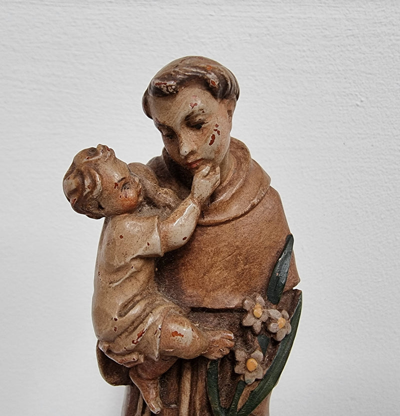 Vintage wood carved St. Anthony and baby Jesus statuette. Hand painted and is in good detailed condition.