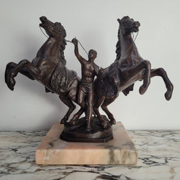 French Art Deco cold painted bronze metal marley horses style statue on a marble base. It is in good condition.