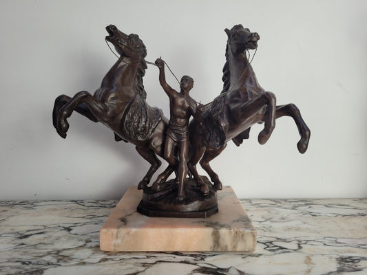 French Art Deco cold painted bronze metal marley horses style statue on a marble base. It is in good condition.