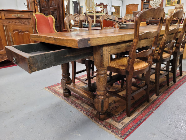 Large impressive 19th century 2.5 meter Antique French Oak farmhouse table. Loads of character with a stunning solid thick top and has a long drawer at one end. Sourced from France and in good original detailed condition.