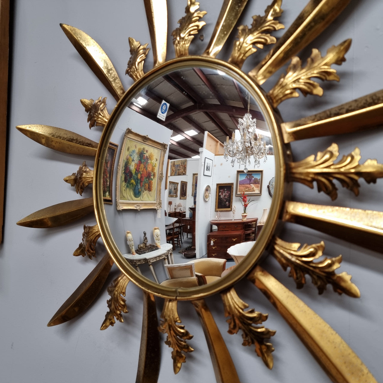 Stunning French Vintage gilt metal starburst convex mirror. It has been sourced from France and in good original detailed condition. Please note mirror does have some spotting due to age but only adds to its character.