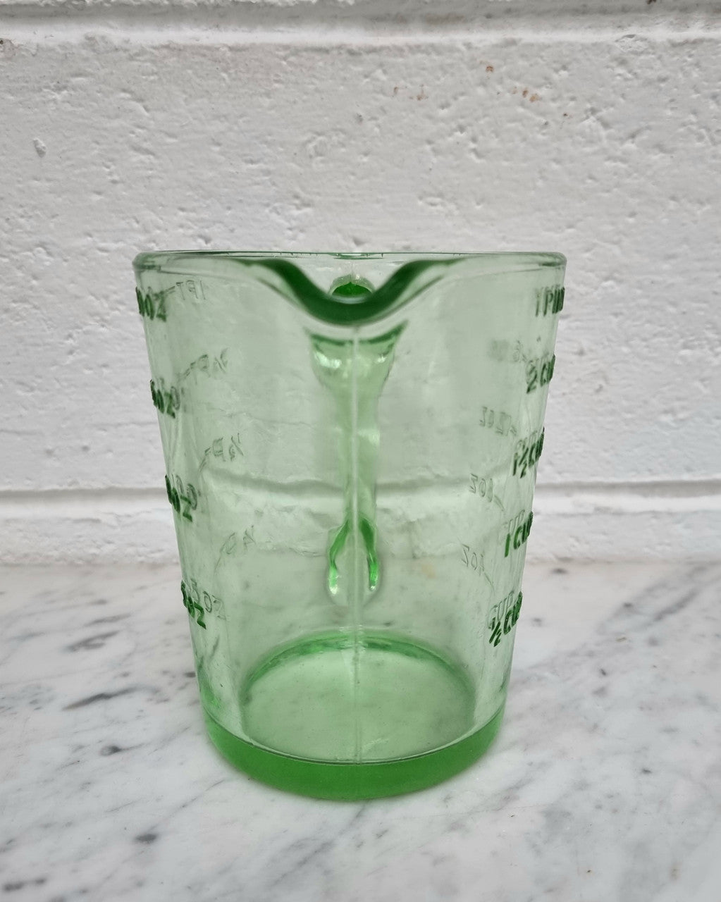 Vintage green depression glass jug. In good original condition.