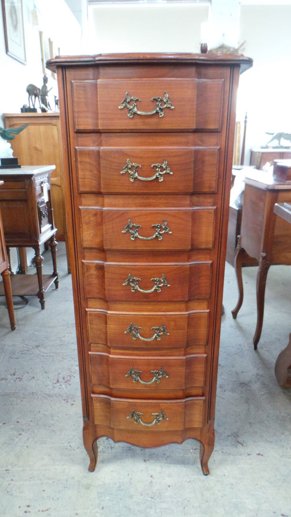 A fabulous petite French Louis XVI style, cherrywood seven drawer semainier. In very good condition.