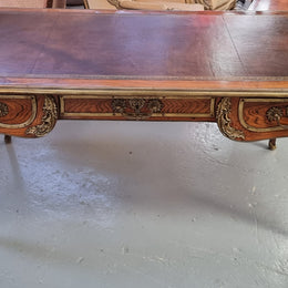 Beautifully fully restored French Antique Rosewood partners desk with beautiful ormolu detail and lovely tooled new leather top. There are three functioning drawers on one side for all your storage needs.