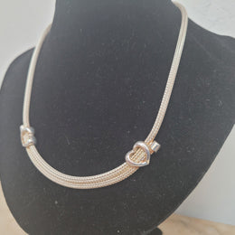 Beautiful Italian sterling silver woven double heart necklace. In good condition.