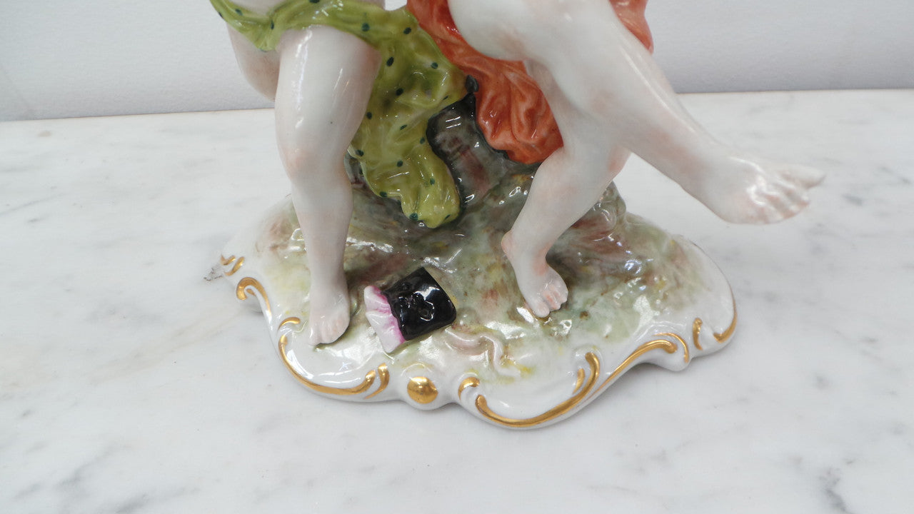 Lovely porcelain 19th century Figurines from the Naples factory. It is in good condition with only slight damage to one finger.