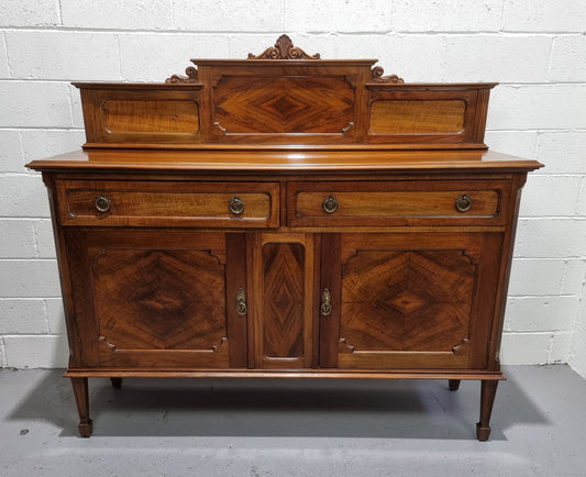 Fabulous Antique two door Blackwood and Fiddleback sideboard with lovely presence and also plenty of room for storage. In original detailed condition.