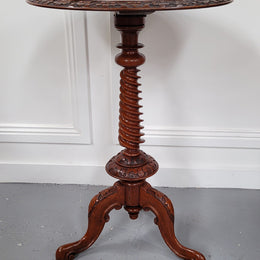 Rare early Victorian Irish Burr Walnut wine table. It has a beautiful carvings and a stunning burr walnut top, on a barley twist column and three shaped legs. It has been sourced locally and is in good original detailed condition. We also have a second table being sold separately which when together make a matched pair.