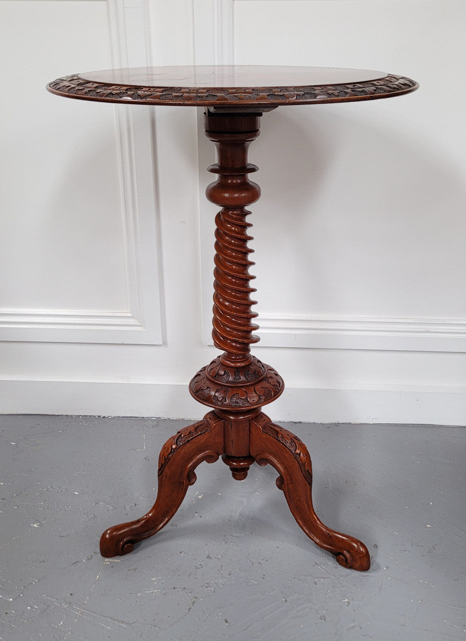 Rare early Victorian Irish Burr Walnut wine table. It has a beautiful carvings and a stunning burr walnut top, on a barley twist column and three shaped legs. It has been sourced locally and is in good original detailed condition. We also have a second table being sold separately which when together make a matched pair.