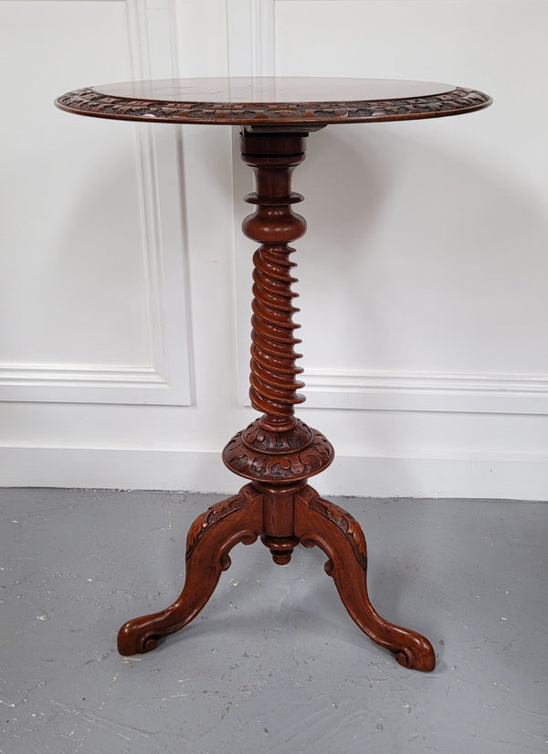 Rare early Victorian Irish Burr Walnut wine table. It has a beautiful carvings and a stunning burr walnut top, on a barley twist column and three shaped legs. It has been sourced locally and is in good original detailed condition. We also have a second table being sold separately which when together make a matched pair.