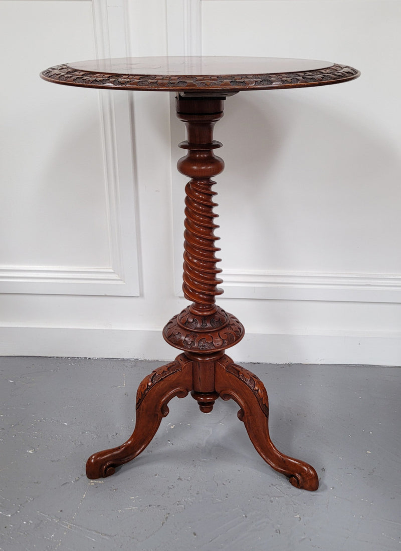 Rare early Victorian Irish Burr Walnut wine table. It has a beautiful carvings and a stunning burr walnut top, on a barley twist column and three shaped legs. It has been sourced locally and is in good original detailed condition. We also have a second table being sold separately which when together make a matched pair.