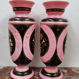 Late Victorian pink and hand painted, enameled pair of vases with some ware to enameling. It is in good original condition.